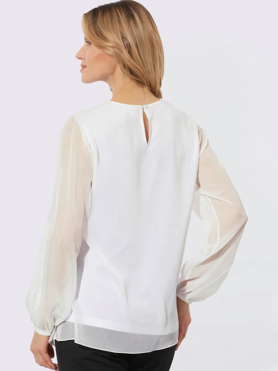 Chemisier en dentelle manches en mousseline transparente