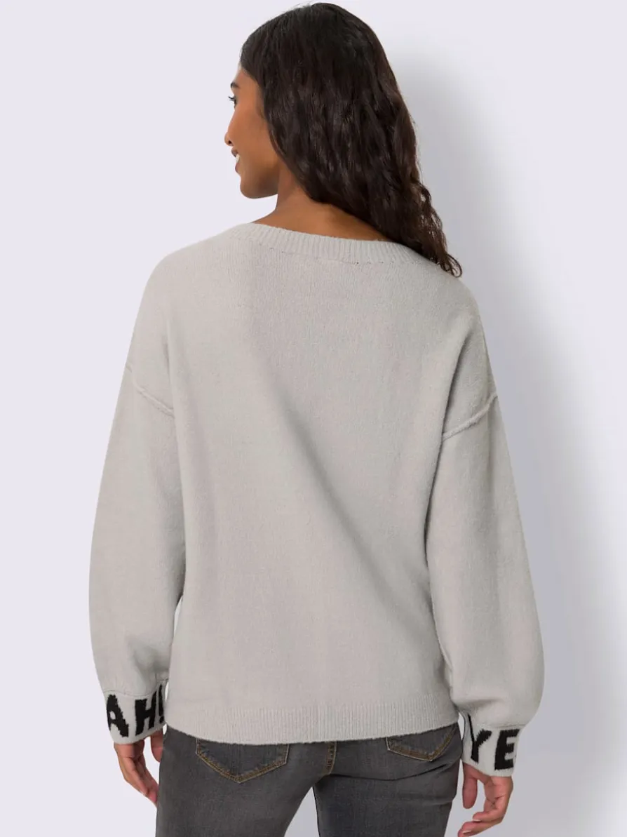 Pull en tricot inscription tendance