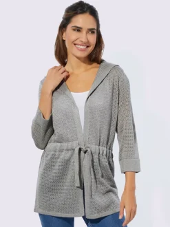 Veste en tricot ajouré coupe longue affinante